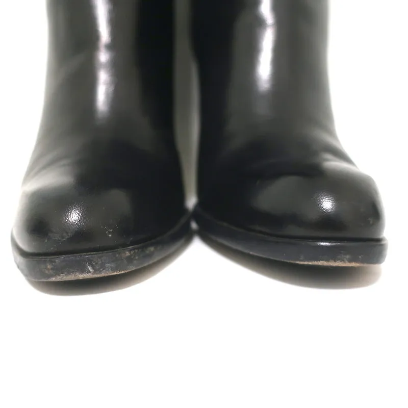 Bottes hautes à revers Costume National en cuir noir taille 39