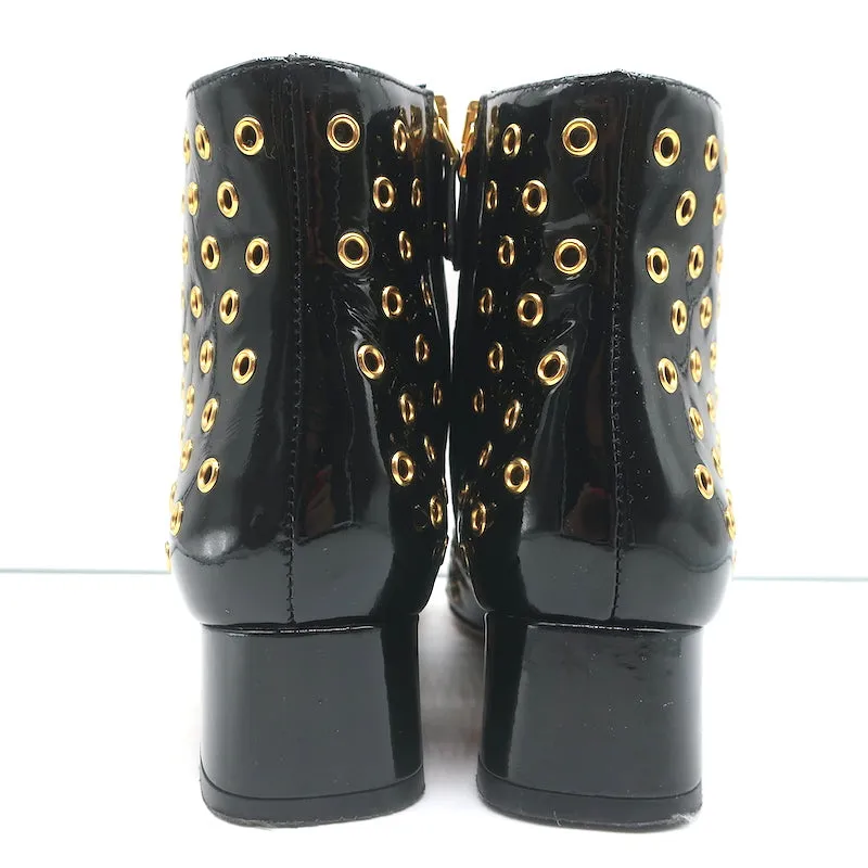 Bottes chelsea RED Valentino à embellissements Gromet en cuir verni noir taille 38
