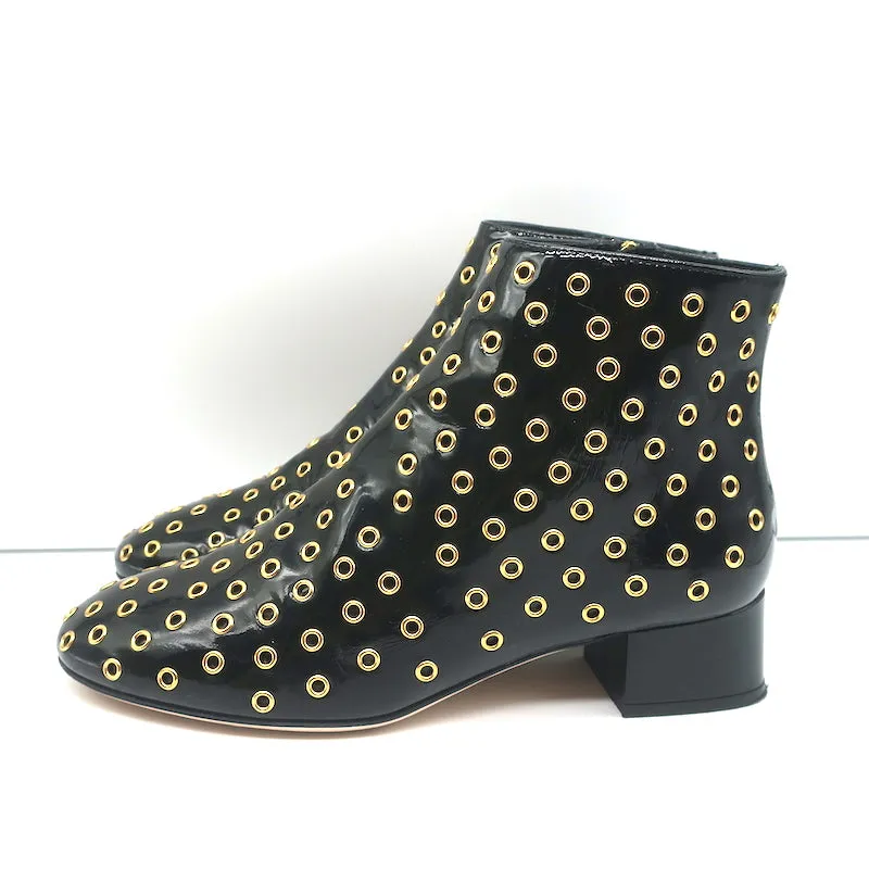 Bottes chelsea RED Valentino à embellissements Gromet en cuir verni noir taille 38